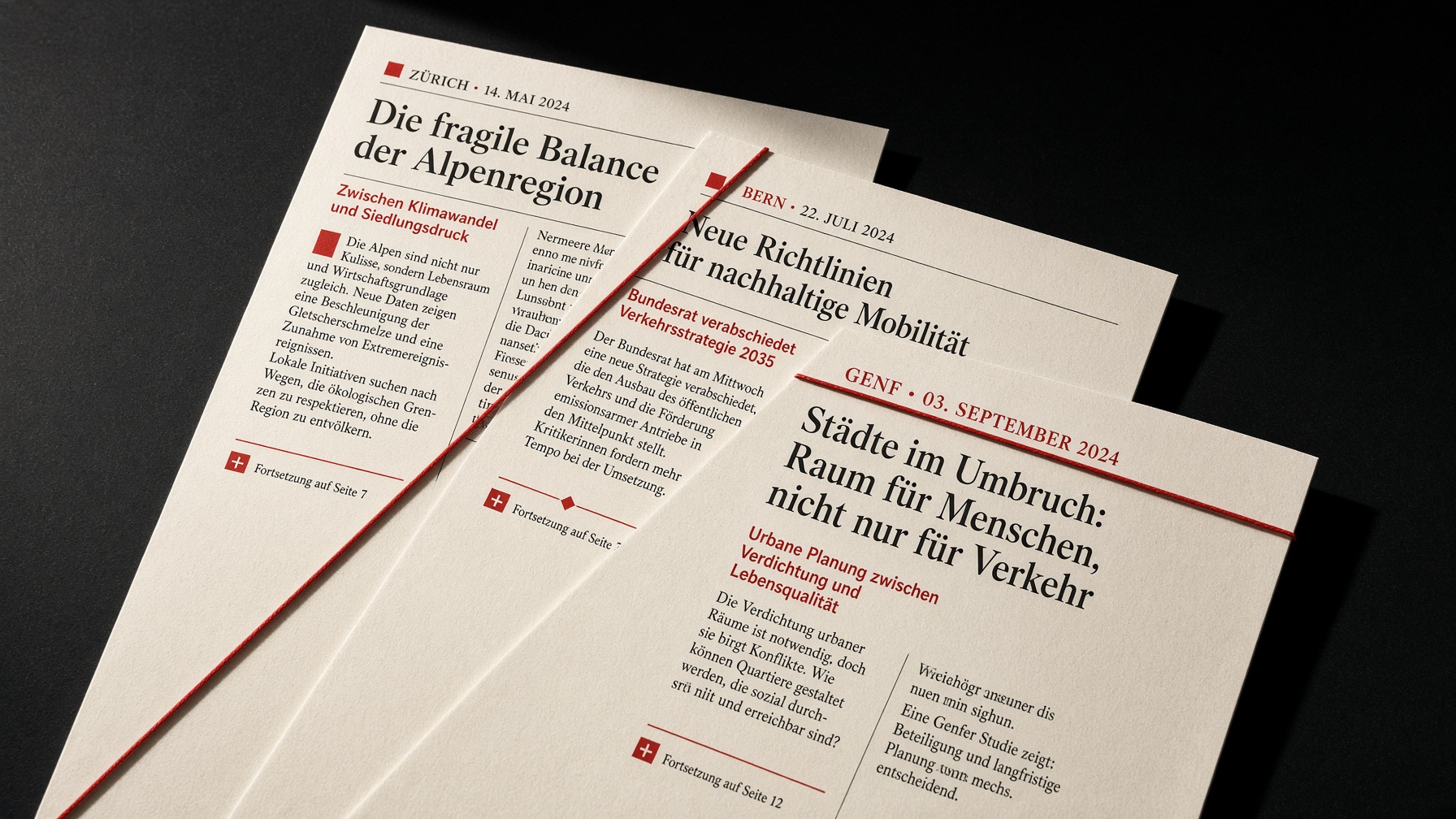 Printed Swiss reports on a desk, aligned with a red thread